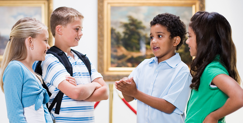 Image of a group of students having a discussion in an art gallery