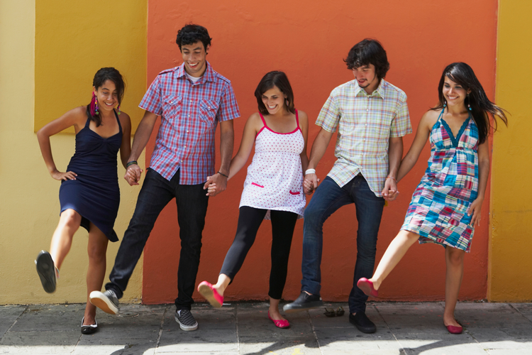 Image of five young people moving in sync