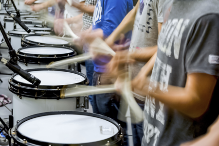 Image of a drumline in motion