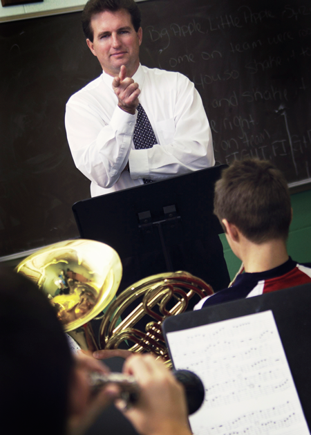 Image of a band director in front of students