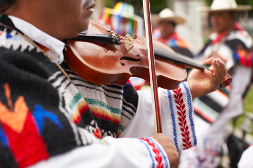 Image of mariachi musician playing violin