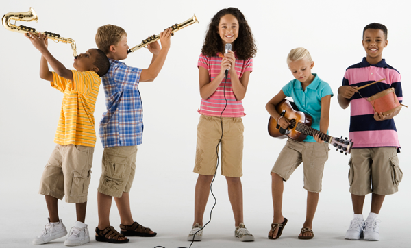 Image of students in a circle having a discussion and using tablets and laptops