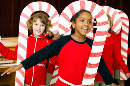 Image of children on stage in holiday-themed performance
