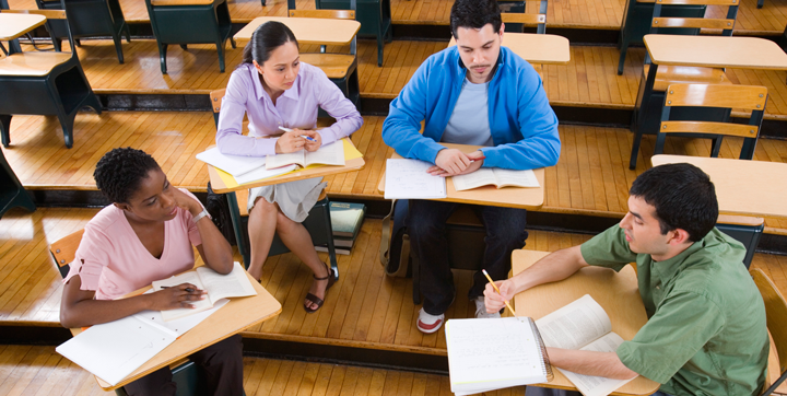 Students studying in group at desks