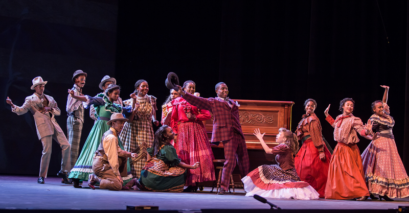 Image of students performing on stage