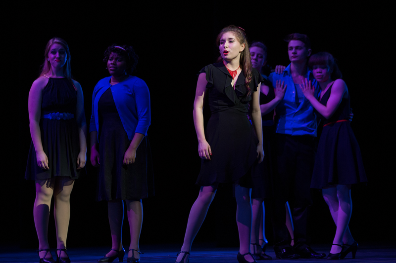 Image of students performing on stage