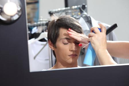 Teen getting makeup for performance