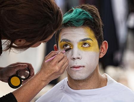 student mime and student reading braille