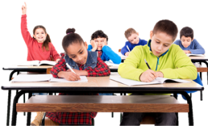 Six elementary students in a classroom. A female student in the back row is raising her hand.