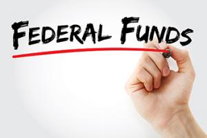 Federal funds written on a transparent wall.