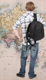 Image of a student standing in front of a map of foreign countries.